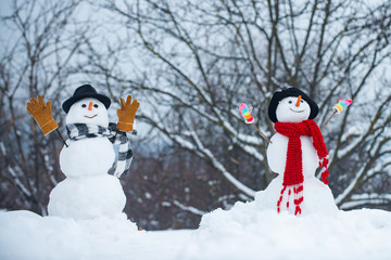 Snowman couple in love have fun Christmas or New Year. Trust in love. Enjoying nice weekend...