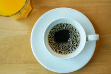 cup of coffee on wooden table