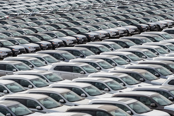 Row of new cars for sale in port