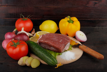 beef with vegetables on wooden background