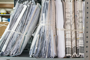 Folders of documents are stacked
