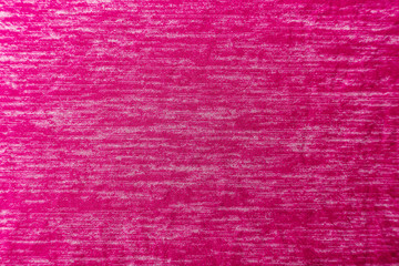 A uniformly lit pink fabric texture with soft shadows.