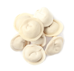 Fototapeta na wymiar Pile of raw dumplings on white background, top view
