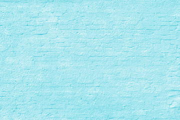light blue plastered brick wall