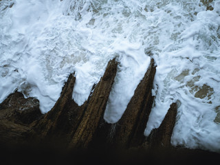 High tide reaching a teeth shaped rock formation