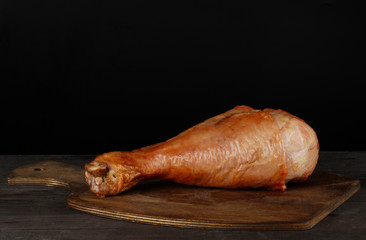 leg of turkey hen on wooden background