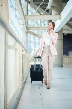 Beautiful business woman is walking in Airport , Business travel concept