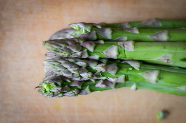 fresh asparagus on wooden table