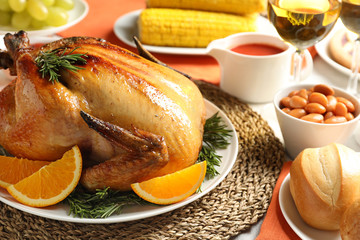 Delicious roasted turkey with garnish on dinner table