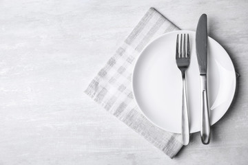 Stylish elegant table setting on wooden background, top view. Space for text