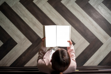 Beautiful woman is reading books in library