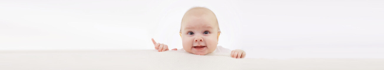 Baby and emotions. Little baby and place for text. Long poster.