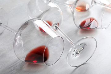 Different glasses with wine on light background, closeup