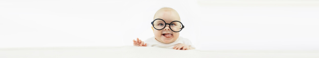 Baby and emotions. Little baby and place for text. Long poster.