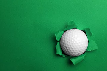 Foto op Aluminium Torn color paper with golf ball, space for text. Sport equipment © New Africa