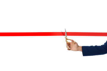 Man in office suit cutting red ribbon isolated on white, closeup