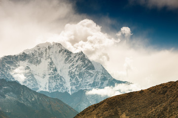 Himalaya mountains with clouds at sunset. Khumbu valley, Everest region, Nepal