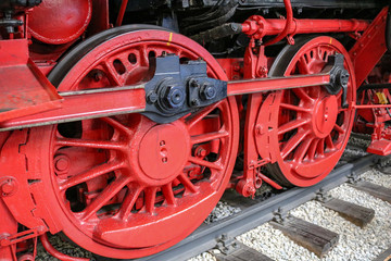 Fototapeta na wymiar Red wheels of a steam locomotive, Speyer, Germany