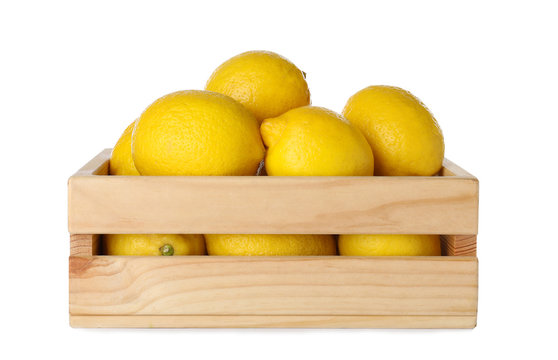 Wooden Crate Full Of Fresh Lemons On White Background