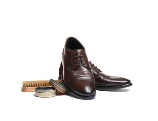 Stylish men's footwear and shoe care accessories on white background