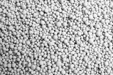 Textured chemical fertilizer for gardening as background, closeup