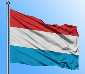 Luxembourg flag waving in the deep blue sky background. Isolated national flag. Macro view shot.