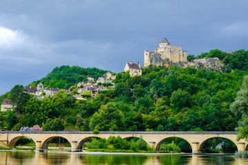 Fototapeta na wymiar Beautiful view of the Dordogne river with bridge and old castle on the rock. Perigord, France