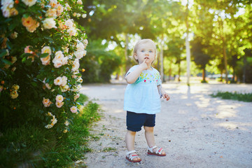 Adorable little girl outdoors in park on a sunny day