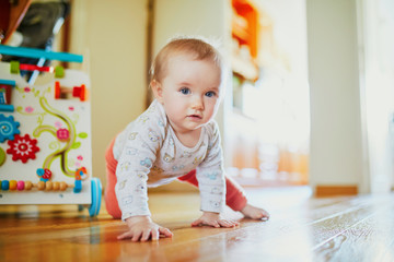 Baby girl learning to crawl