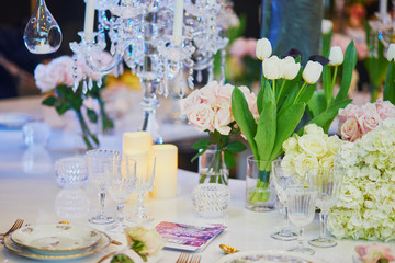 Beautiful table set with candles and flowers