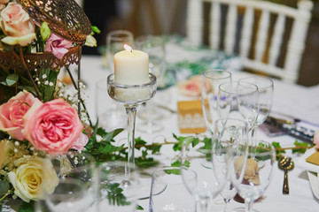 Beautiful table set with candles and flowers