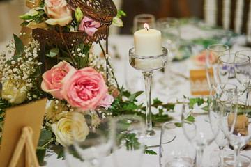 Beautiful table set with candles and flowers
