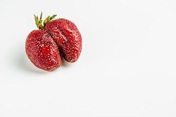 ugly strawberry on white background isolated