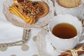 cookies with marmalade, sugar, seeds with tea for breakfast in retro cups