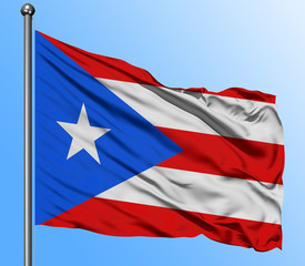 Puerto Rico flag waving in the deep blue sky background. Isolated national flag. Macro view shot.