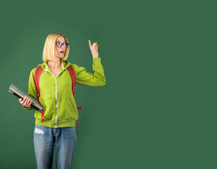 Young happy student. Student studying in the classroom. Happy casual girl student with over...