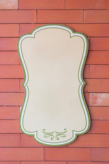 Blank vintage sign on red wall