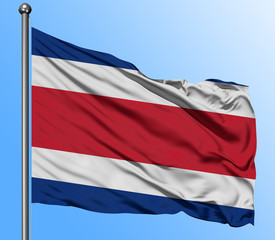 Costa Rica flag waving in the deep blue sky background. Isolated national flag. Macro view shot.