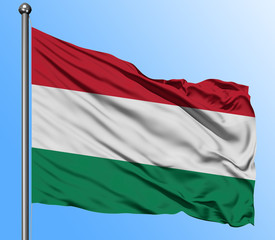Hungary flag waving in the deep blue sky background. Isolated national flag. Macro view shot.