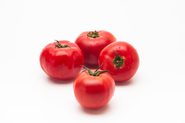  Fresh tasty tomatoes on a white background