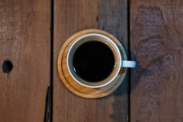 americano cup coffee on wooden table, Top view