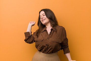 Naklejka premium Young curvy russian woman dancing and having fun.