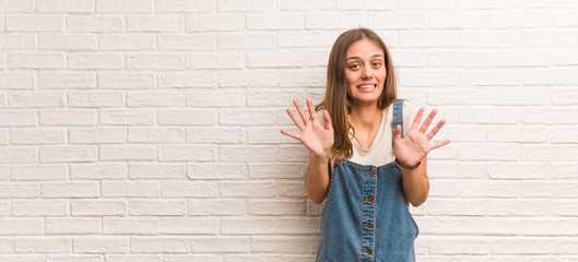 Young hipster woman rejecting something doing a gesture of disgust