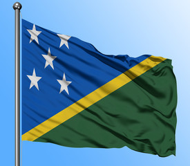 Solomon Islands flag waving in the deep blue sky background. Isolated national flag. Macro view shot.