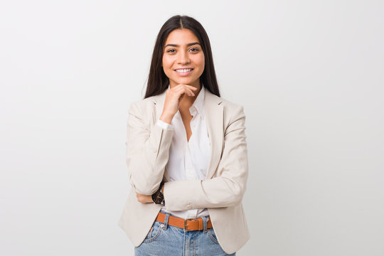 Young business arab woman isolated against a white background smiling happy and confident, touching chin with hand.