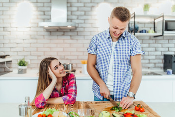 Man and woman chef cook frying pan vegetables vegan vegetarian eat , sunny day love .
