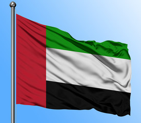 Fototapeta na wymiar United Arab Emirates flag waving in the deep blue sky background. Isolated national flag. Macro view shot.