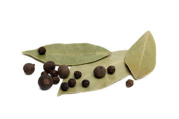 Bay leaf, allspice and pepper isolated on white background