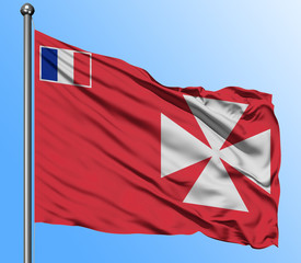 Wallis And Futuna flag waving in the deep blue sky background. Isolated national flag. Macro view...
