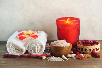  Himalaya salt with towels and dry rose, spa set concept.